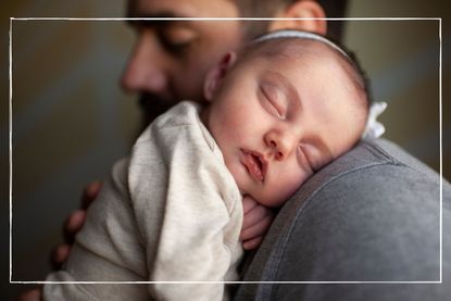 newborn baby's face sleeping on father's shoulder