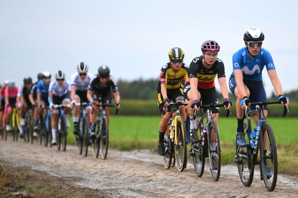 ROUBAIX FRANCE OCTOBER 02 LR Lotte Kopecky of Belgium and Team Liv Racing Aude Biannic of France and Movistar Team and the peloton compete through cobblestones sector during the 1st ParisRoubaix 2021 Womens Elite a 1164km race from Denain to Roubaix ParisRoubaixFemmes ParisRoubaix on October 02 2021 in Roubaix France Photo by Tim de WaeleGetty Images