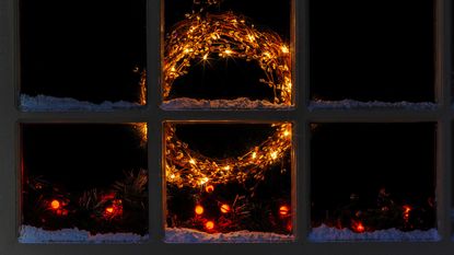 christmas wreath light in window