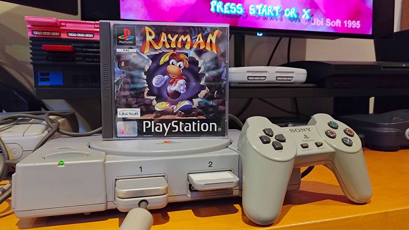 Rayman PS1 case sitting on top of console next to controller.