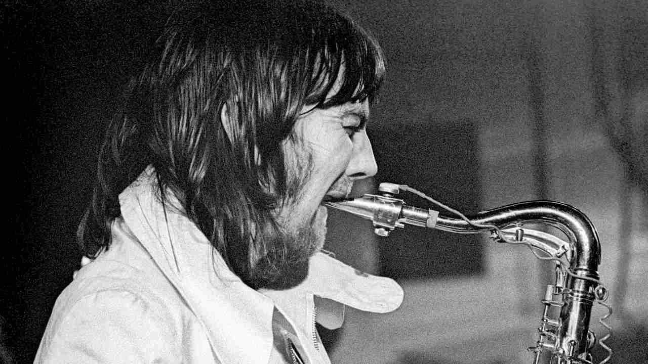 Chris Wood performing onstage in 1973