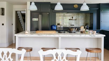 Kitchen with large kitchen island and table in foreground