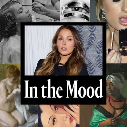 a white woman with brown hair in a black jacket in the center of a graphic design with white text that says "in the mood"