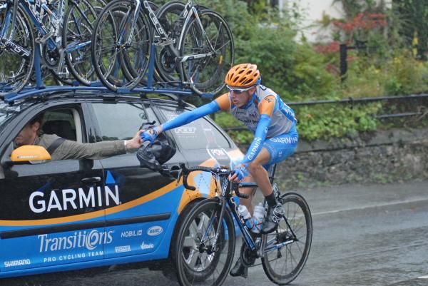 Dan Martin heads back to the Garmin-Transitions car for some rain gear.