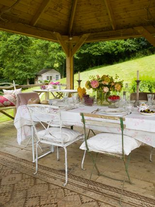 alfresco dining area with florals and linens