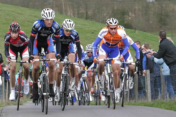 Riders climb the Vam hill.