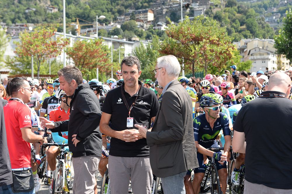 UCI President Brian Cookson chats with Vuelta director Javier Guillen before the start of stage 12.