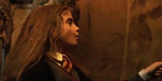 Hermione Granger (Emma Watson) unlocking a door in Harry Potter and the Sorcerer's Stone