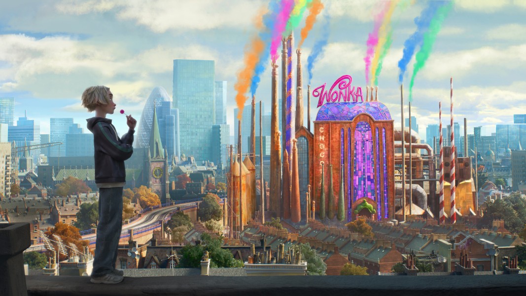 An animated blonde-haired boy stands on a rooftop looking toward a vibrant, whimsical Wonka chocolate factory that emits colorful smoke into a city skyline.