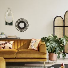 living room with yellow sofa, painted in Dulux Egyptian Cotton