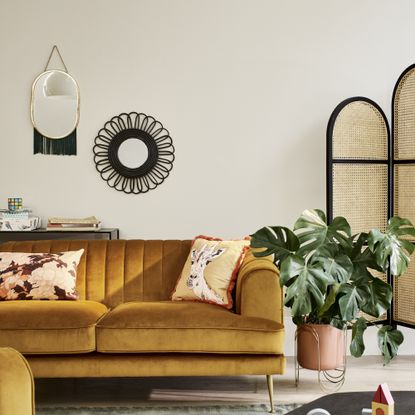 living room with yellow sofa, painted in Dulux Egyptian Cotton