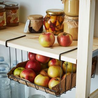 kitchen storage with under shelf basket for fruit