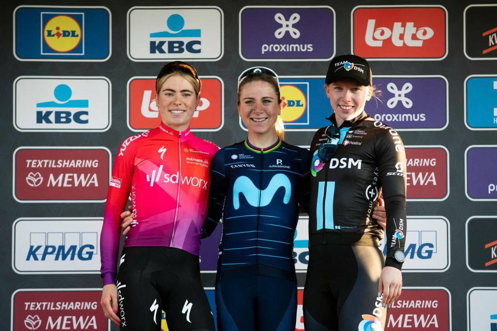 LR second placed Demi Vollering of Team SD Worx winner Annemiek van Vleuten of Movistar Team and third placed Lorena Wiebes of Team DSM from Netherlands celebrate on the podium at the finish of the womens elite race of the Omloop Het Nieuwsblad oneday cycling race 1284km from Gent to Ninove on February 26 2022 Belgium OUT Photo by KRISTOF VAN ACCOM Belga AFP Belgium OUT Photo by KRISTOF VAN ACCOMBelgaAFP via Getty Images