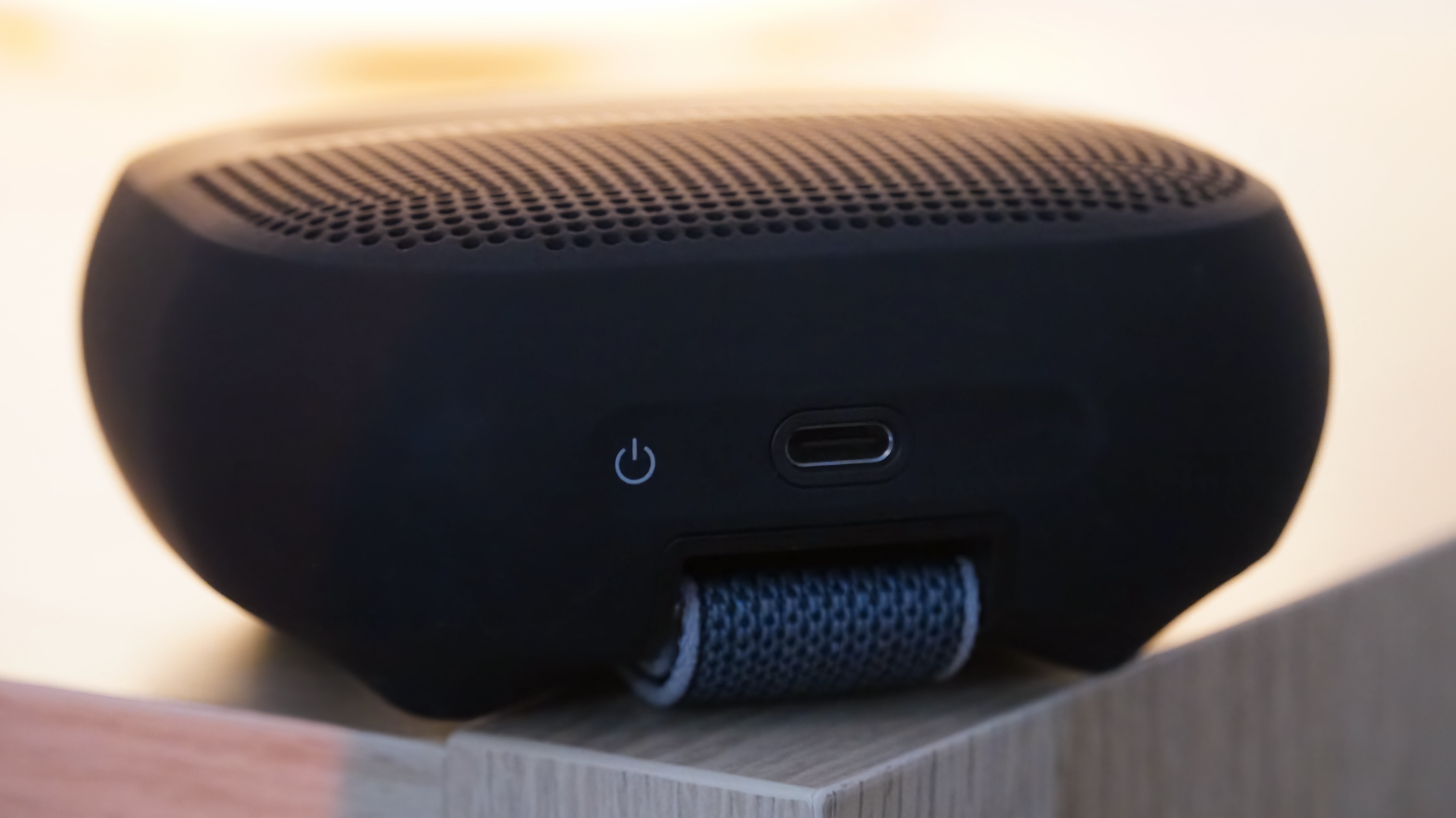 The Bose SoundLink Micro 2 in black showing the power button and USB-C port.