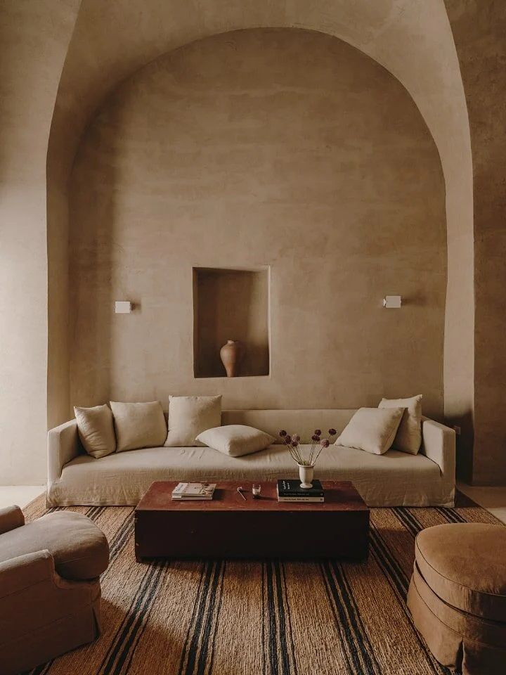 A rural home is turned into a contemporary design retreat with neutrally colored sculptural furniture and plaster walls.