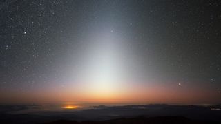 a pyramid of light in the night sky