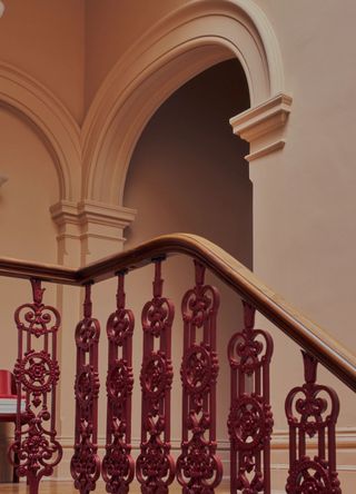 picture of arched doorway and staircase bannister