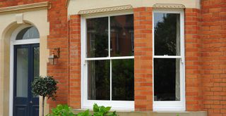 accoya sash window in brick building