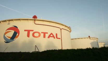ANTWERP, BELGIUM - NOVEMBER 23:Gas containers featuring the Total corporate logo at the Total Refinery on November 23, 2006 in Antwerp, Belgium. Total Refinery Antwerp, the second largest ref