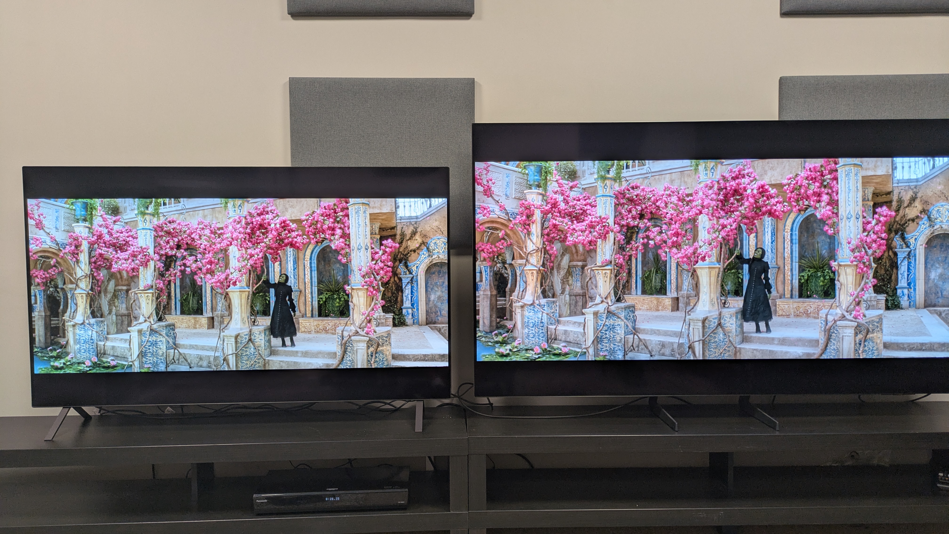 LG B5 (left) and Samsung S85F (right) showing Elphaba from Wicked on screen