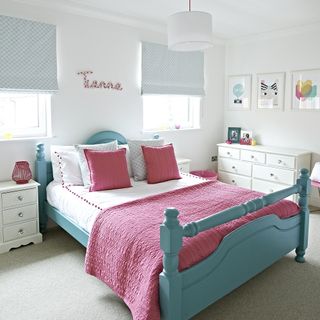 white bedroom with painted wooden bed