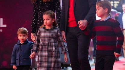  Prince William, Duke of Cambridge and Catherine, Duchess of Cambridge with their children, Prince Louis, Princess Charlotte and Prince George, attend a special pantomime performance at London's Palladium Theatre, hosted by The National Lottery, to thank key workers and their families for their efforts throughout the pandemic on December 11, 2020 in London, England. 