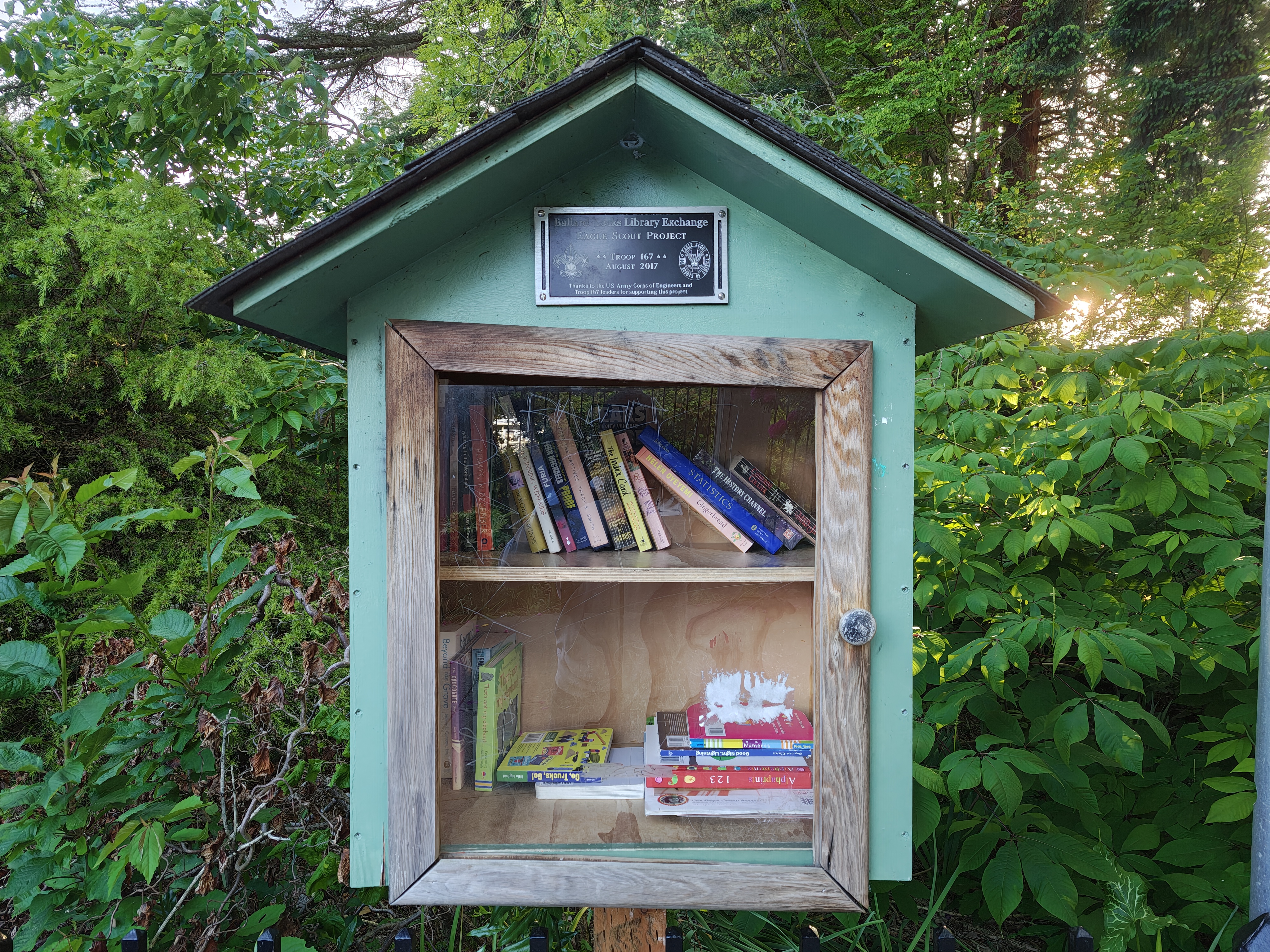 A wooden box with books inside