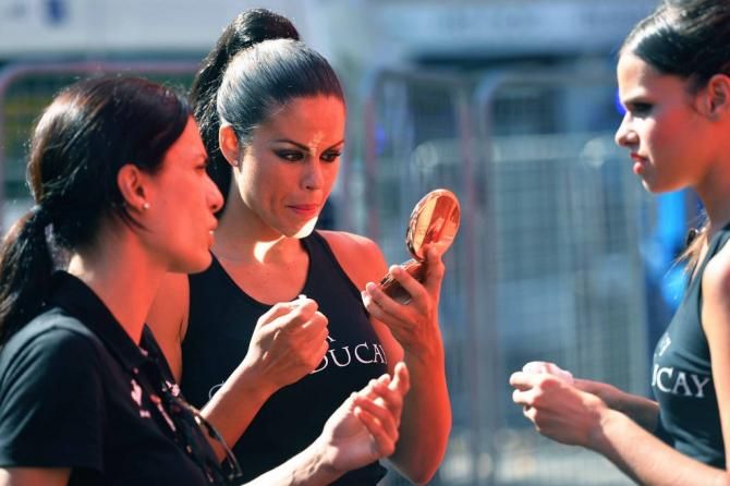 The podium hostesses checking their make up