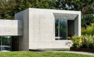 Concrete house with glass windows