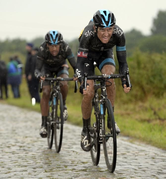Geraint Thomas (Sky) leads Richie Porte across the cobbles