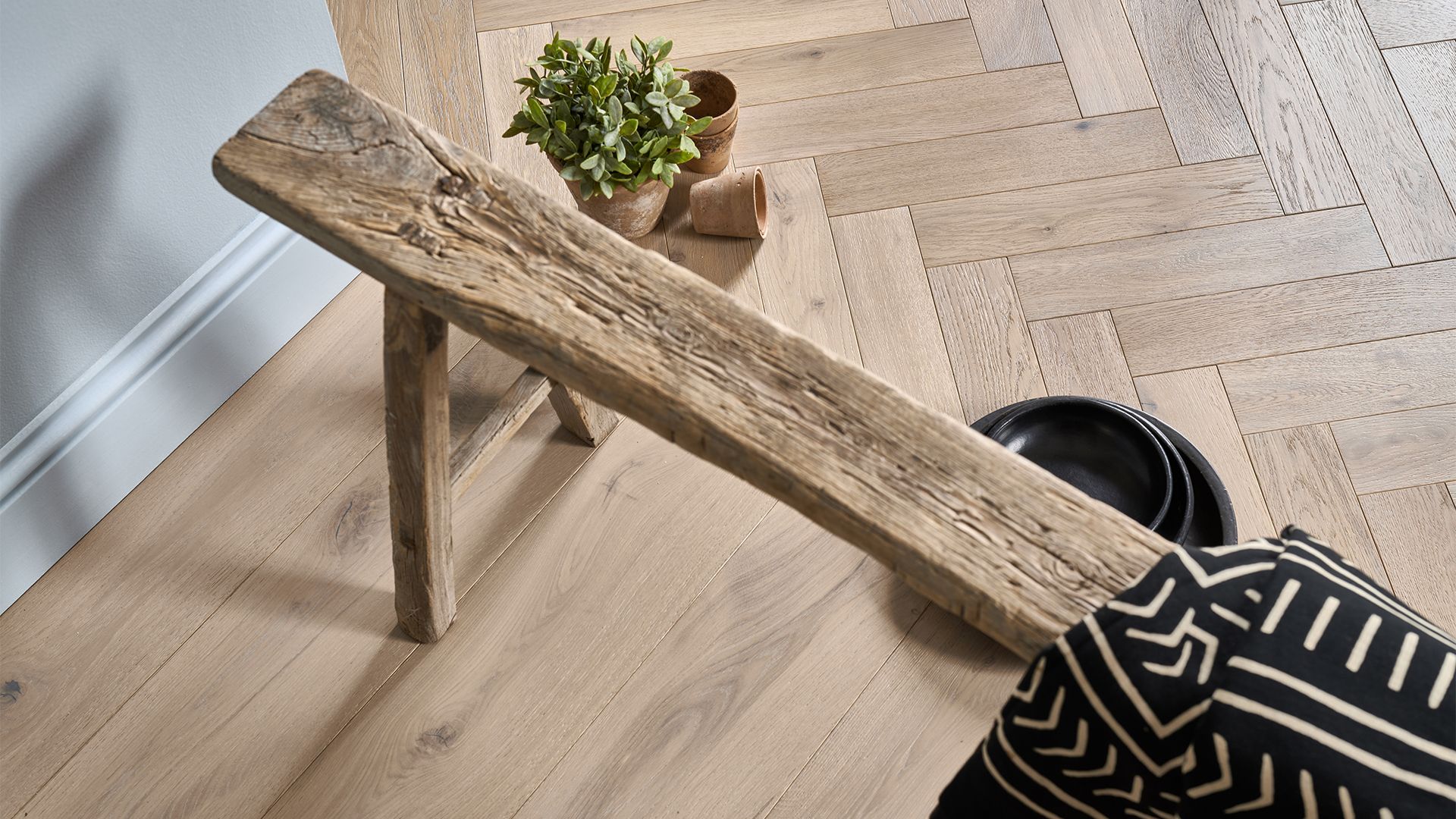 Wooden rustic bench positioned on wooden floor