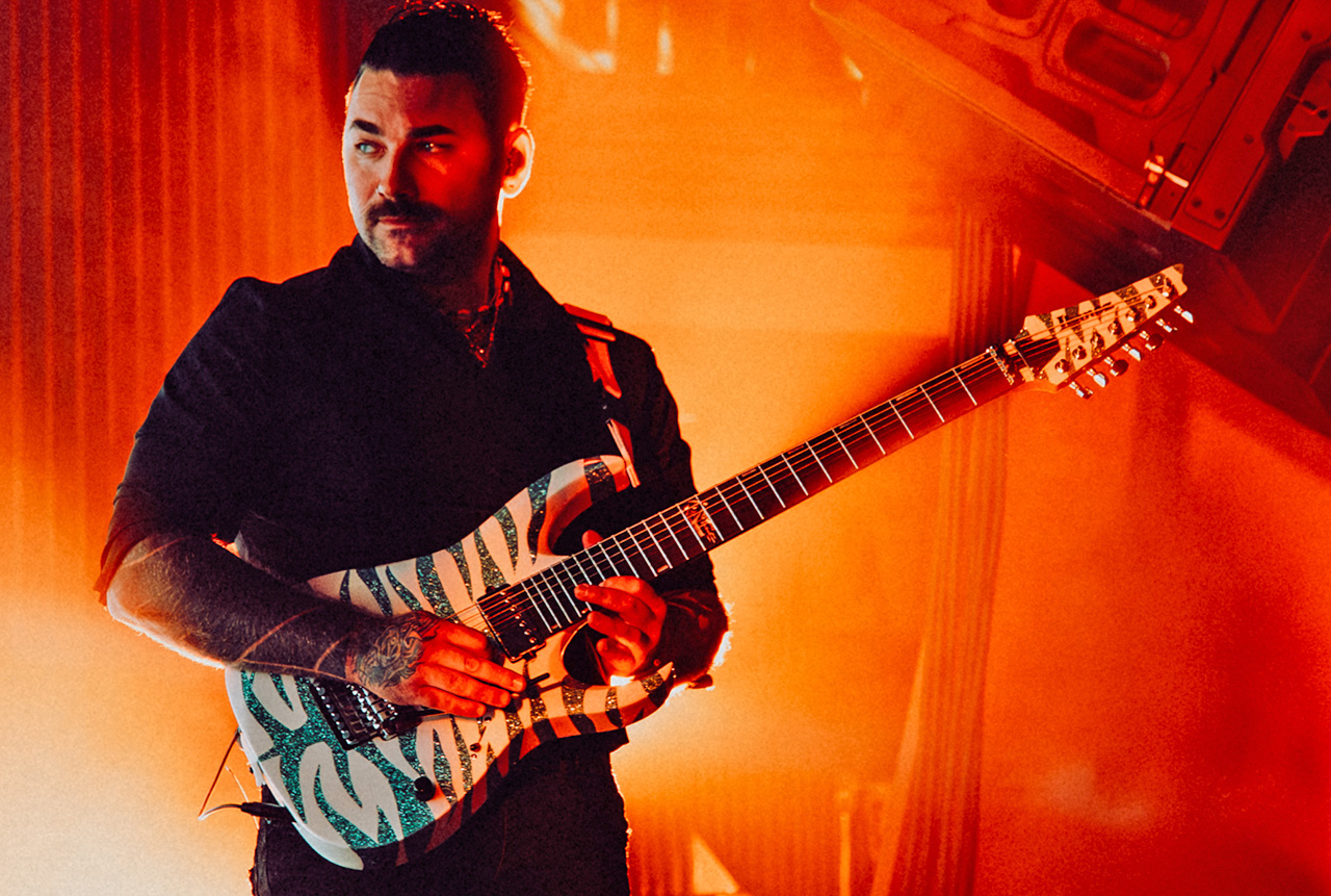 Lorna Shore&amp;rsquo;s Adam De Micco with one of his Ibanez custom guitars
