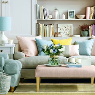 Pastel sofa, armchair and ottoman in living room