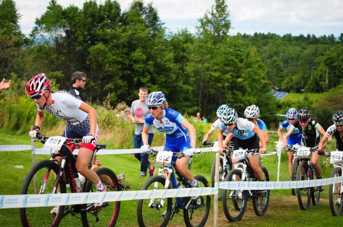 Lea Davison (Specialized) leading up the hill with three laps to go