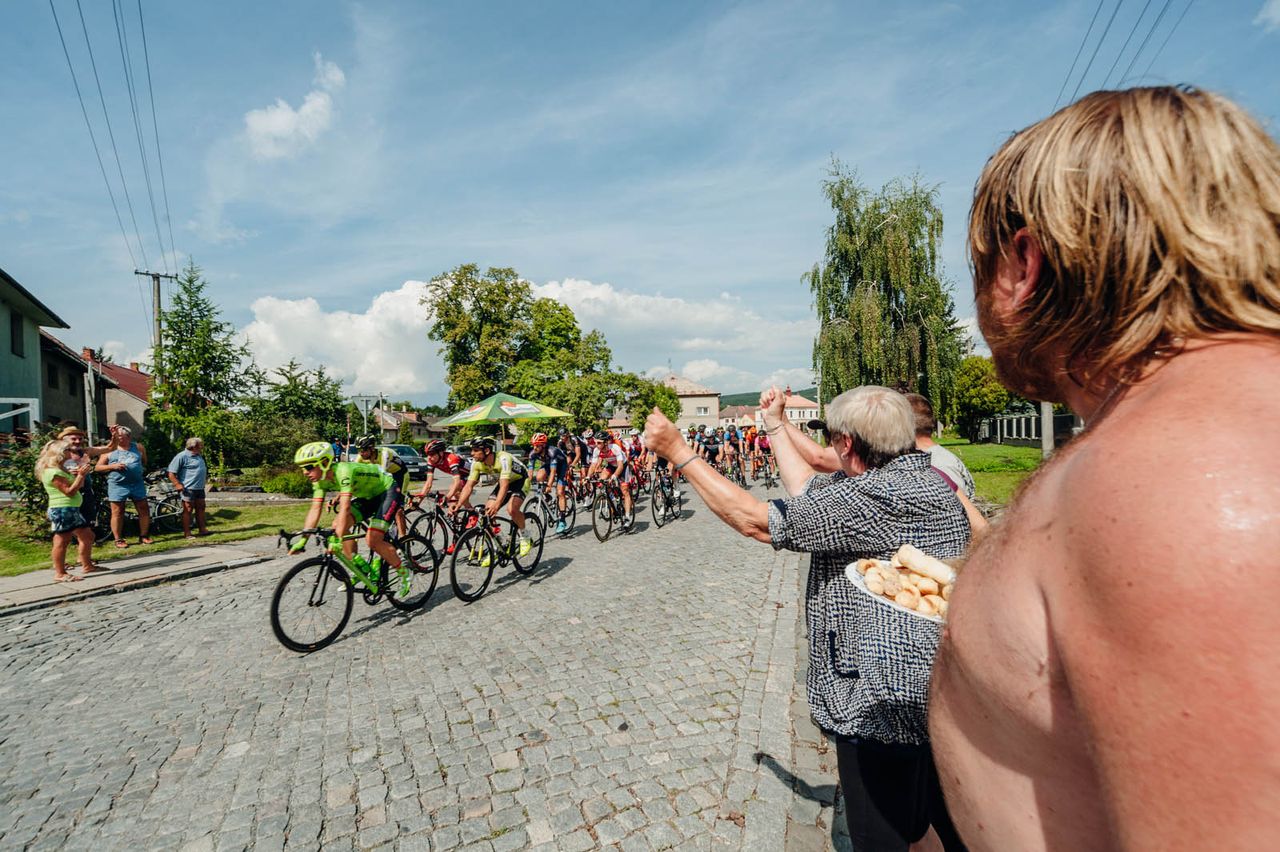 Fans cheer on the peloton