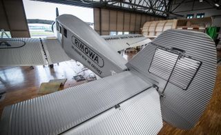 Rimowa aircraft finishing stage in the factory in Switzerland. We see the aircraft from higher ground in the hangar.