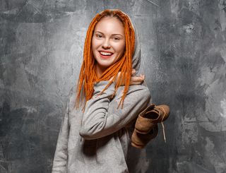 hipster girl with red hair in dreadlocks.