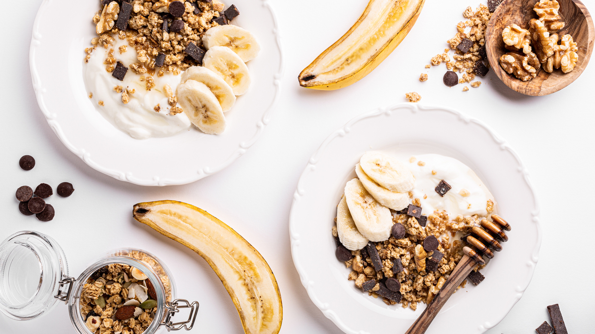 image shows greek yogurt with homemade granola and banana