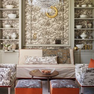 wallpaper with shelf on wall and sofa with cushions