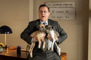Jeremy Swift and greyhound puppies in Ted Lasso