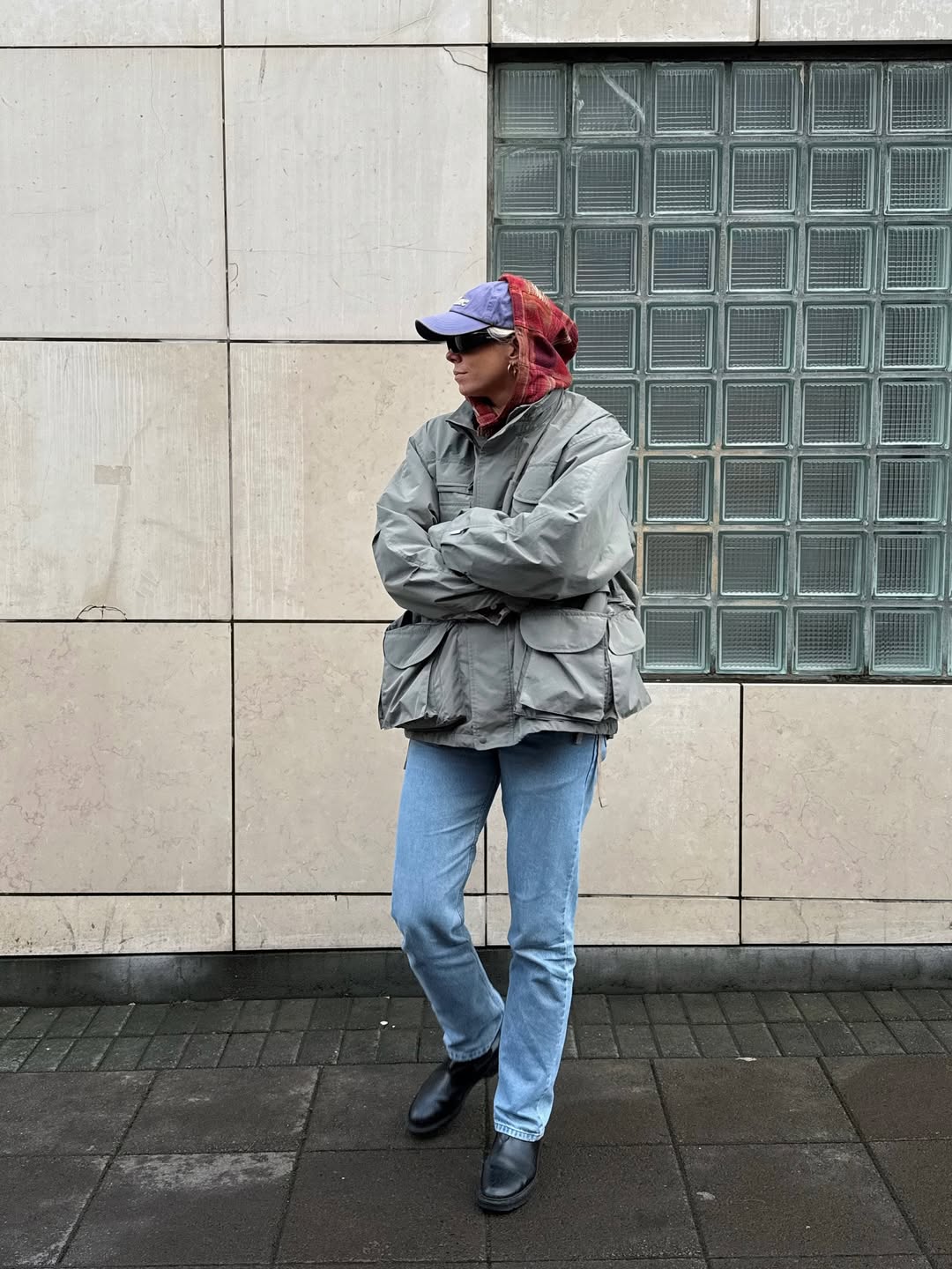 Lindsey Holland wears khaki utility jacket and jeans