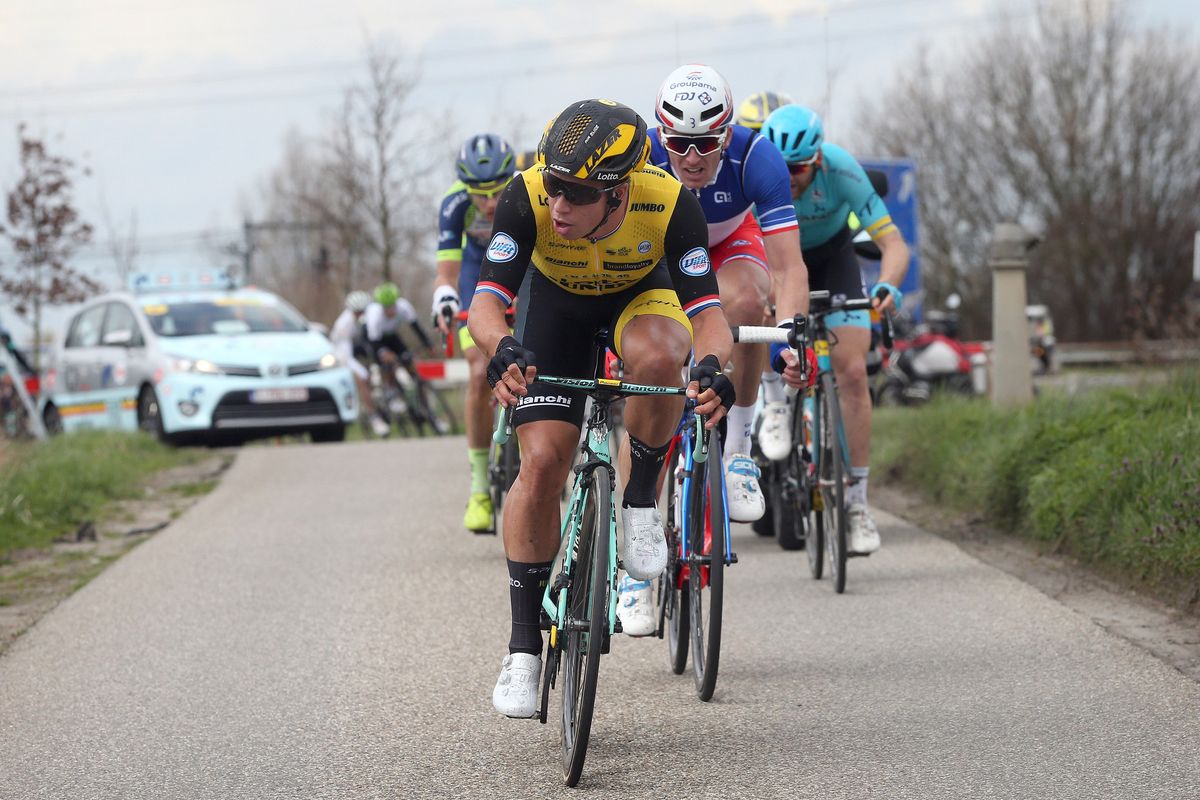 Dylan Groenewegen and Arnaud Demare chase after the level crossing