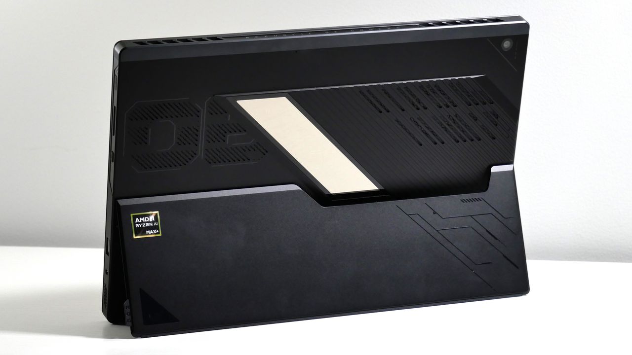 Asus ROG Flow Z13 (2025) propped up by a kickstand on a white desk, highlighting the back of the tablet.
