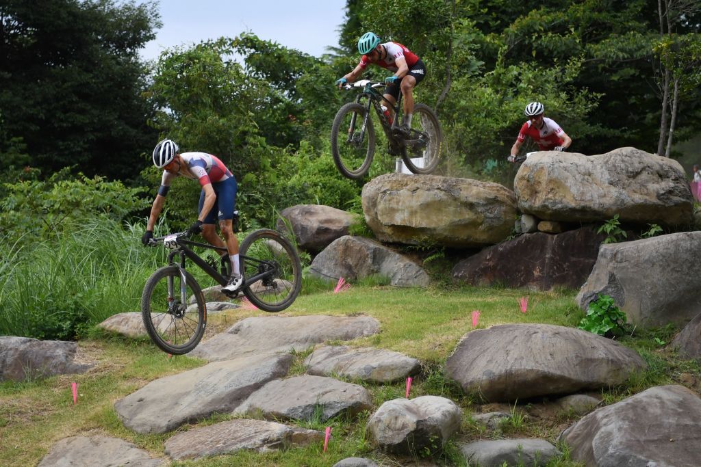 Top men&#039;s contenders for gold include Tokyo Olympic Games winner Tom Pidcock of Great Britain (left), and Swiss riders Nino Schurter (centre) and Mathias Flückiger (right)