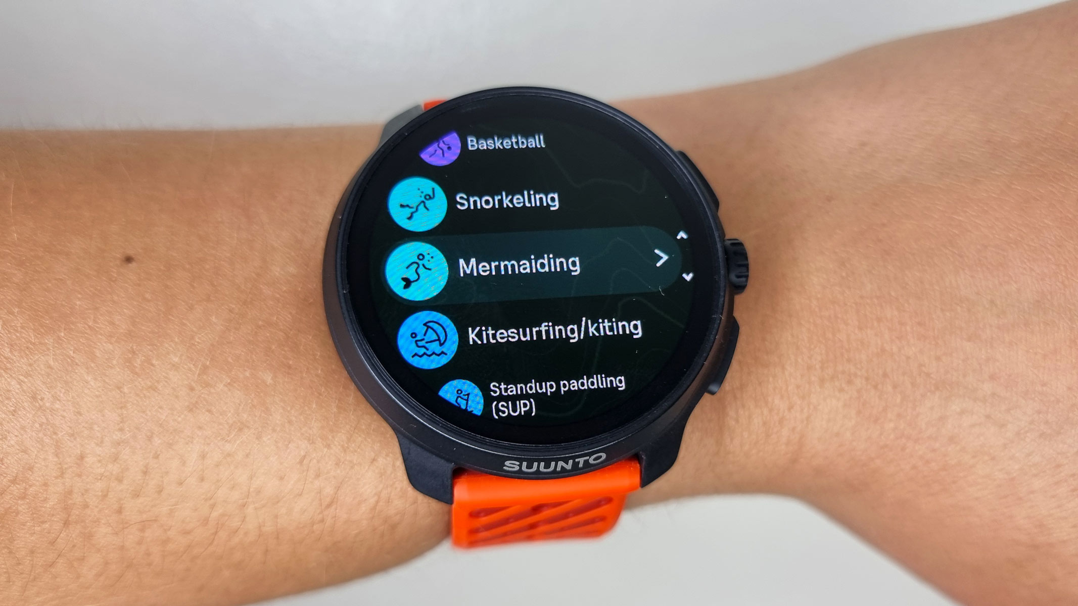 The screen of the Suunto Race 2 showing various workout options, while being worn by our reviewer.