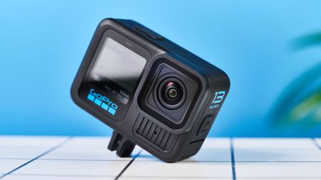 GoPro Hero13 Black on a white surface with a blue background