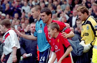 09 February 2003, Manchester - FA Premiership - Manchester United v Manchester City - captains Steve Howey of City and Roy Keane of United lead out their teams. (Photo by Mark Leech/Offside via Getty Images)