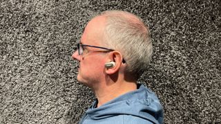 Bose QuietComfort Ultra Earbuds being worn in someone's left ear