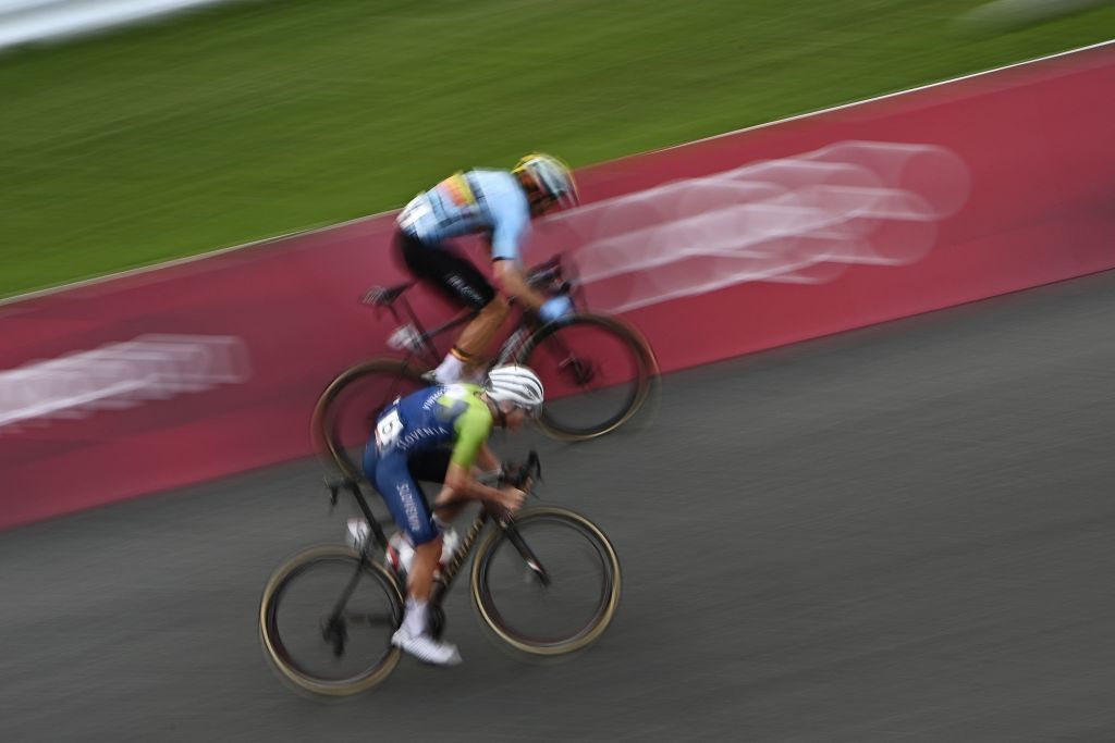Slovenias Tadej Pogacar front and Belgiums Wout van Aert sprint to the finish line for the second position during the mens cycling road race of the Tokyo 2020 Olympic Games at the Fuji International Speedway in Oyama Japan on July 24 2021 Photo by Jeff PACHOUD AFP Photo by JEFF PACHOUDAFP via Getty Images