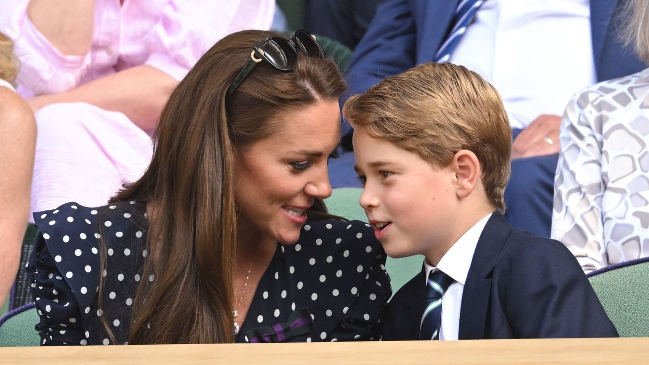 The Princess of Wales talks to Prince George in the Royal Box at Wimbledon